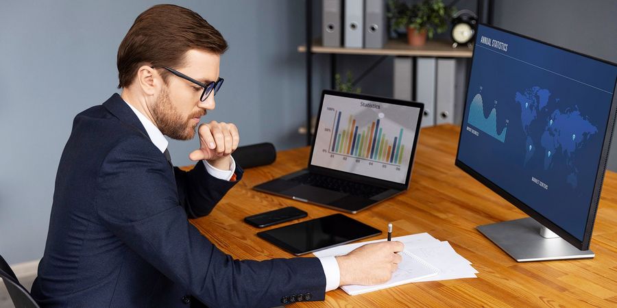 person-looking-finance-graphs