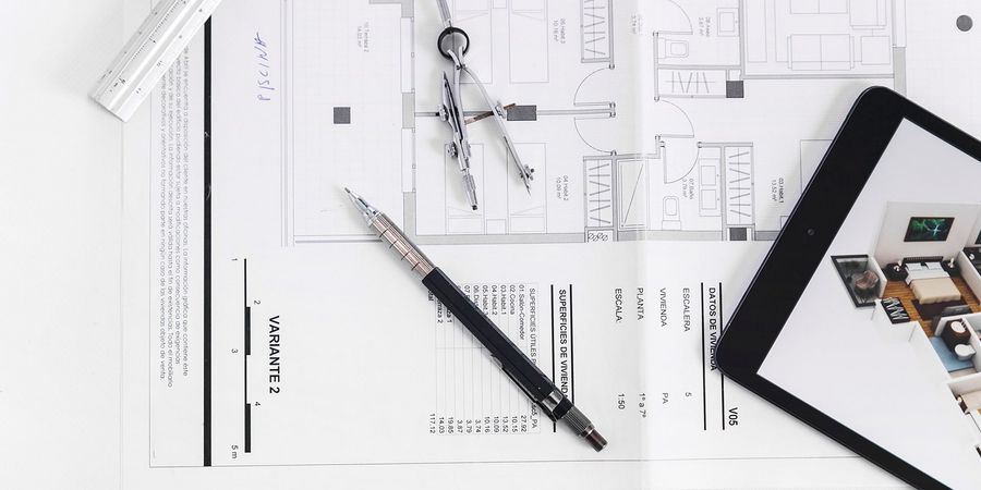 freepik.comfree-photoclose-up-tablet-drafting-tools-blueprint_2110869